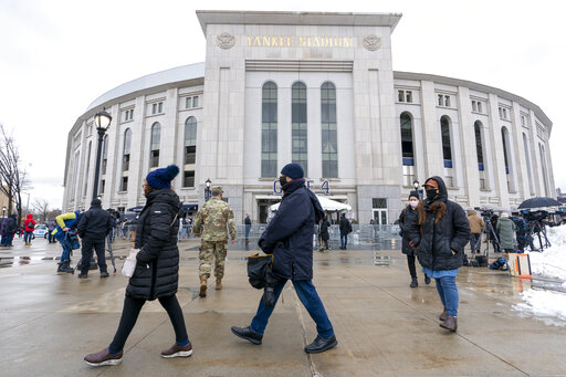The Latest: Yankee Stadium draws lines as vaccination site