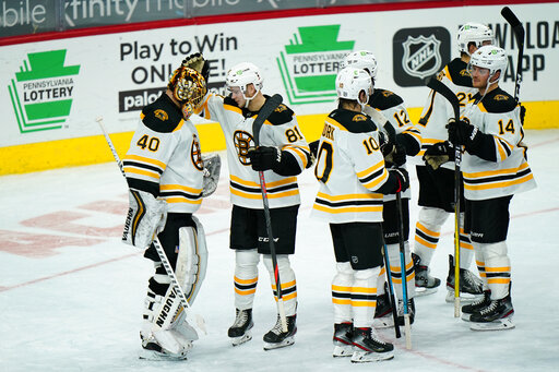 Kuraly, Marchand lead Bruins past Flyers