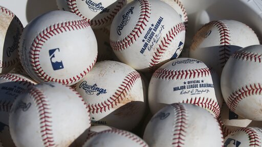 AP source: MLB slightly deadening ball amid HR surge