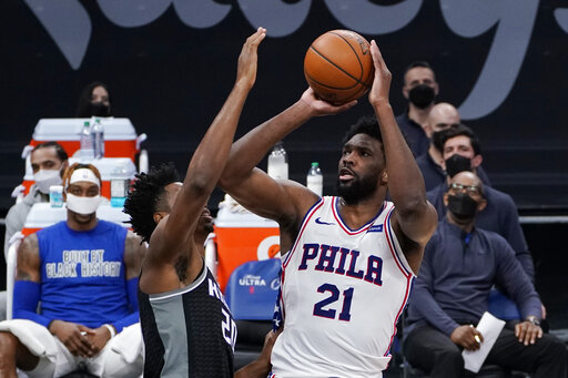 Embiid helps 76ers pull away late for 119-111 win over Kings